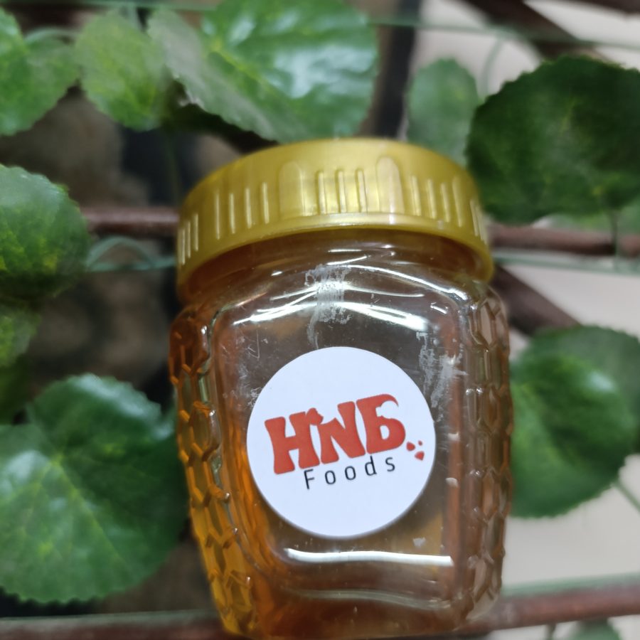 A single small jar of HNB Foods honey